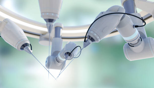 Picture Close-up of robotic surgical arms with precision instruments converging over an operating field.